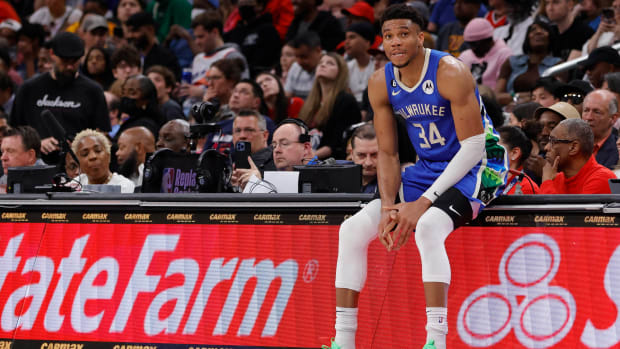 Giannis waits along the sidelines to re-enter a game.